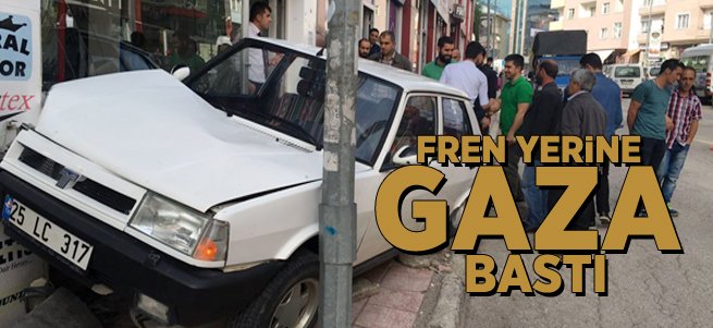 Fren yerine gaza basınca mağazaya girdi